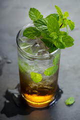 Glass of cold drink with fresh mint leaves