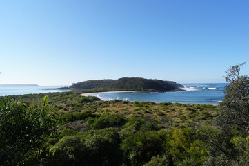 Fototapeta na wymiar View of Coastal Island on a Clear Day. Broulee Island, Australia. 