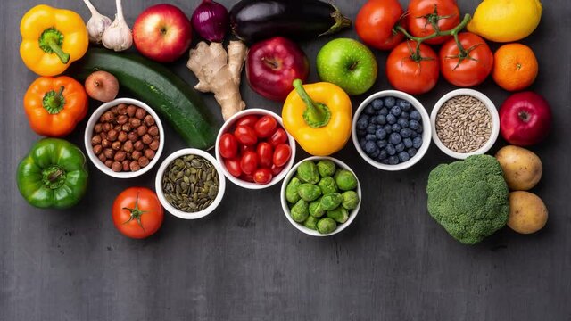 Healthy eating ingredients: fresh vegetables, fruits and superfood. Nutrition, diet, vegan food concept.