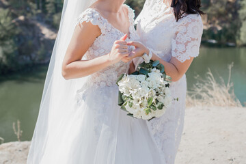 bride with bridesmaids in park