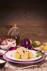 Potato gnocchi stuffed with radicchio and ricotta.	
