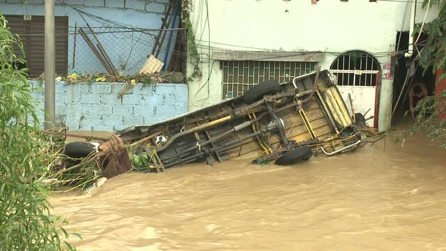 Destroyed Vehicle In Deadly Flood Waters In Manila Philippines
