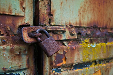 old rusty lock on an old rusty bus