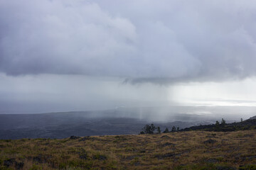 Rain pours down along the coast on the lava beach in Hawaii Volcanoes National Park on the Big Island.