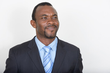 Portrait of handsome bearded African businessman in suit
