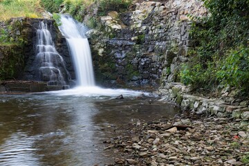 Fototapeta premium Water overflow near old mill.