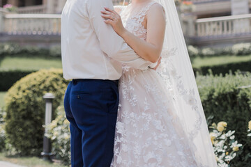 Fototapeta na wymiar groom with bride together in summer park