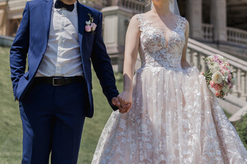 Obraz na płótnie Canvas groom with bride together in summer park