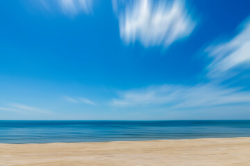 Motion of the sky and sea with soft white clouds.