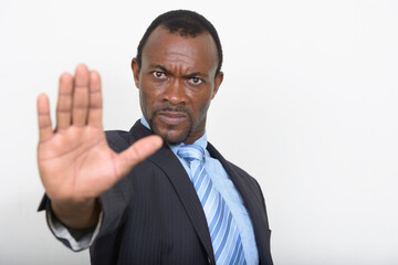 Portrait of handsome bearded African businessman in suit