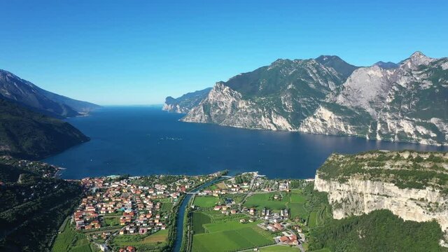 Riva del Garda, Torbole, Lake Garda, Italy, panorama at high altitude. Slow motion in flight