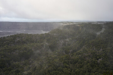 Kīlauea caldera and its surrounding tropical rainforest seen from Volcano House Overlook at dusk in Hawaii Volcanoes National Park on the Big Island, on November 26, 2019.