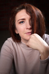 Portrait of middle age woman on black background