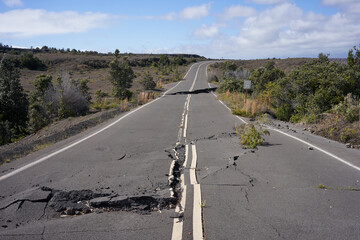 Asphalt road damaged by the volcanic eruption of Kīlauea and caldera collapse with subsequent...