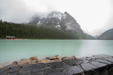 A picture of lake Louise and mountains taken on a rainy morning.   Banff National park  AB Canada 

