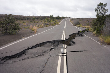 Asphalt road damaged by the volcanic eruption of Kīlauea and caldera collapse with subsequent...