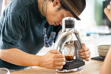 Fototapeta premium Barista use manual process to make espresso with classic espresso machine