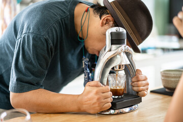 Barista use manual process to make espresso with classic espresso machine