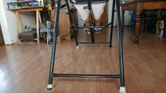 Mature man using inversion table