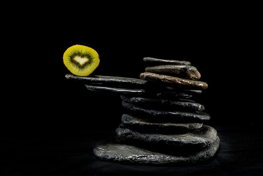 
Creative pictures of fresh kiwis on slate and black background