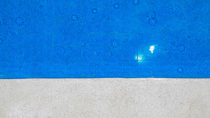 water in the pool with raindrops