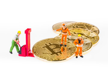 Miniature engineer and worker are mining and transferring Bitcoin activity. Conceptual design for technology of Cryptocurrency and Blockchain