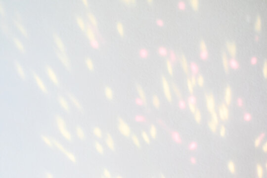 Blurred overlay effect for photo and mockups. Wall texture with organic drop diagonal shadow and rays of light on a white wall. shadows for natural light effects