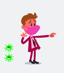Surprised businessman with mask and virus COVID points to something
