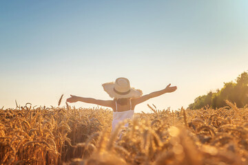 A child in a wheat field. Selective focus. © yanadjan