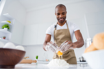 Portrait of his he nice attractive cheerful cheery guy professional confectioner making fresh bread pide boat national culinary in modern light white interior house kitchen