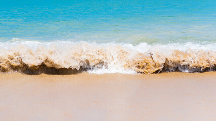 Close up beautiful sea wave on tropical sand beach in summer background