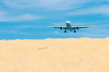 Fototapeta na wymiar Commercial airplane flying takeoff from international airport with clear sky.