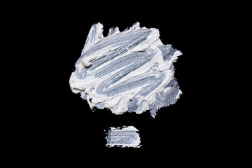 Brushstroke with a thick white paint, isolated on a black background.