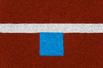 Fototapeta premium Red stadium running track closeup