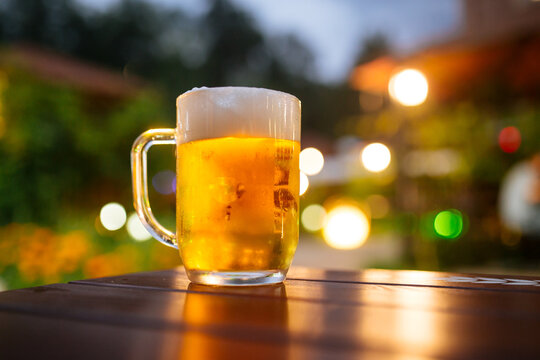 Beer Foam Outside With Blurry Lights Background