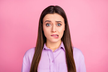 Fototapeta premium Close-up portrait of her she nice-looking attractive lovely pretty charming shine cute worried straight-haired girl biting lip expecting bad news isolated over pink pastel color background