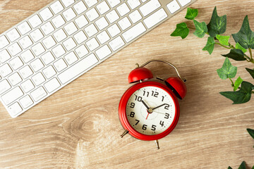 Computer and alarm clock. Work hours, working hours, telework, business, job changes, etc....
