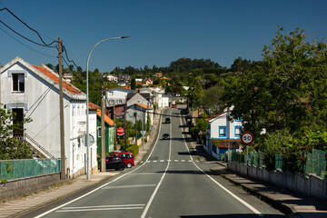 Fototapeta na wymiar Countryside roadway in a sunny day in Galicia, Spain