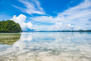 Calm Ocean, Shallow water, Lagoon, Green hills and Beach view of Omekang Island, Rock Island Southern Lagoon, Palau, Pacific, UNESC world heritage site