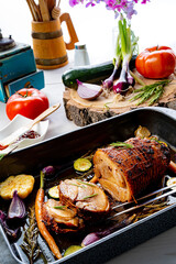 Lecere roll roast with vegetables and herbs.