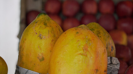 Stack of ripe papaya fruit for sale at the market