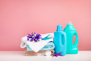 Detergent with washing powder and towels isolated on white