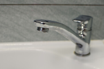 water flowing from faucet in bathroom