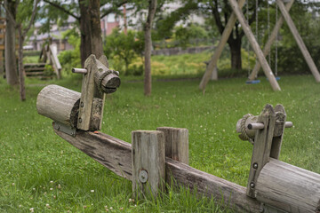 Fototapeta premium wooden horse shaped see-saw in a park
