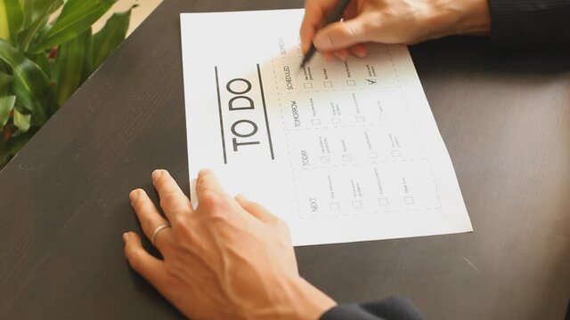 Woman filling the todo list