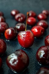 Bright juicy ripe cherry on a dark background.