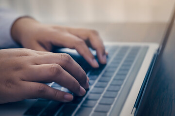 Person using a laptop computer for online training webinar. E-learning browsing connection and cloud online technology webcast concept. Laptop with copy space for webinar ads.