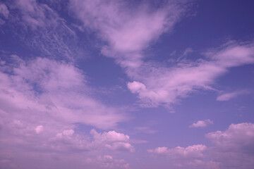 Pink sunset. Sky with clouds. Delicate purple sky background.