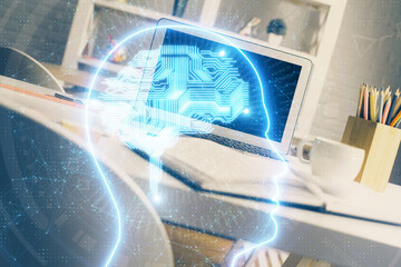 Double exposure of work space with computer and human brain drawing hologram. Brainstorm concept.