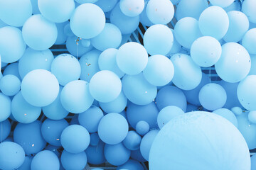 many blue balloons on the wall